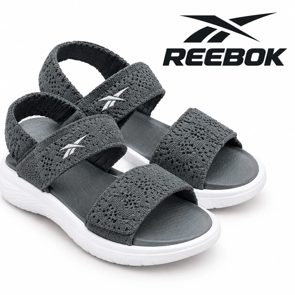 Reebok grey multi-strap sandals with textured upper, open-toe design and contrasting white sole
