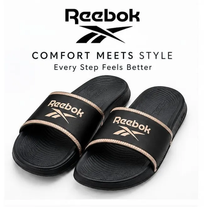 Reebok black slip-on sandals with tan-trimmed logo strap and textured footbed.
