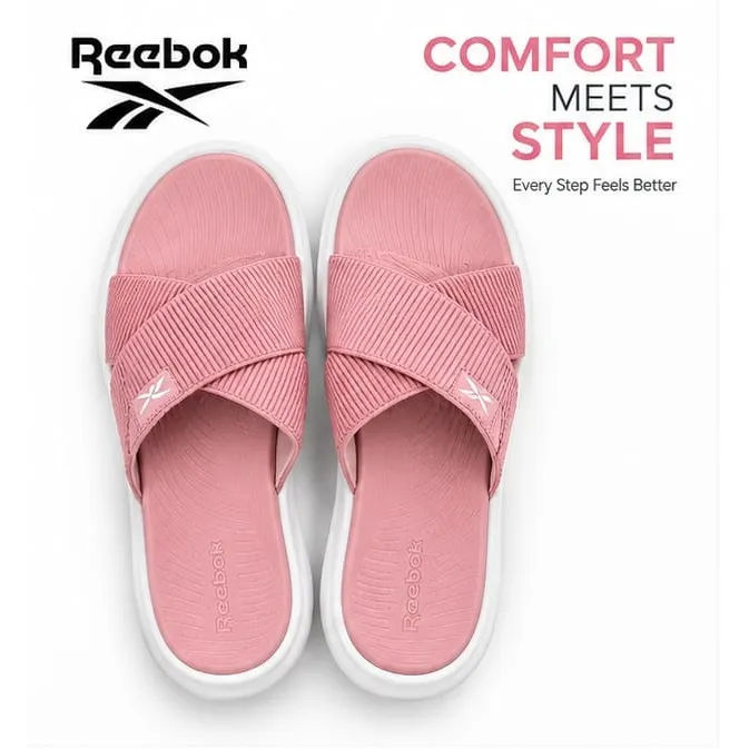 Reebok Reflux Stack women's sandals in Coral Rose pink with ribbed crossover straps and white sole.