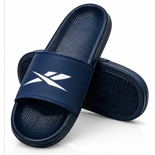 Reebok black slide sandals with white Vector-style logo and open-toe slip-on design