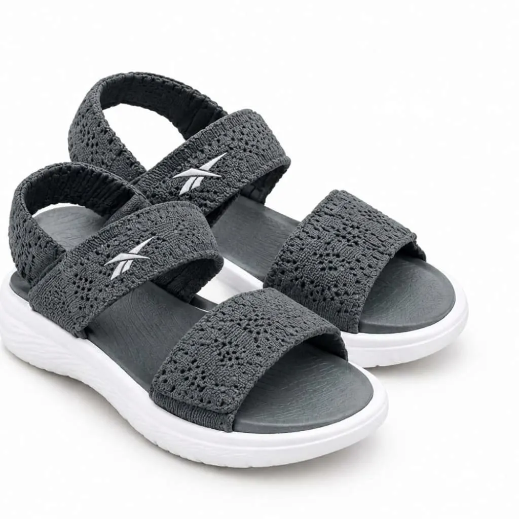 Reebok grey multi-strap sandals with textured upper, open-toe design and contrasting white sole